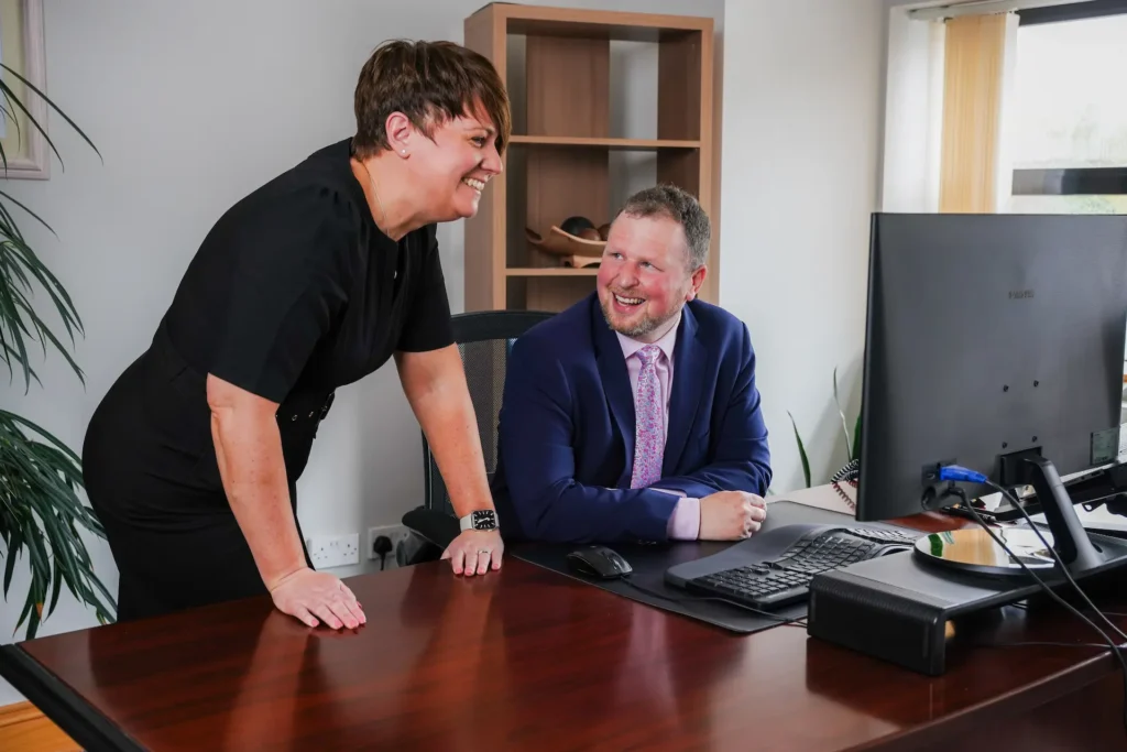 Fiona and Alan looking at computer screen